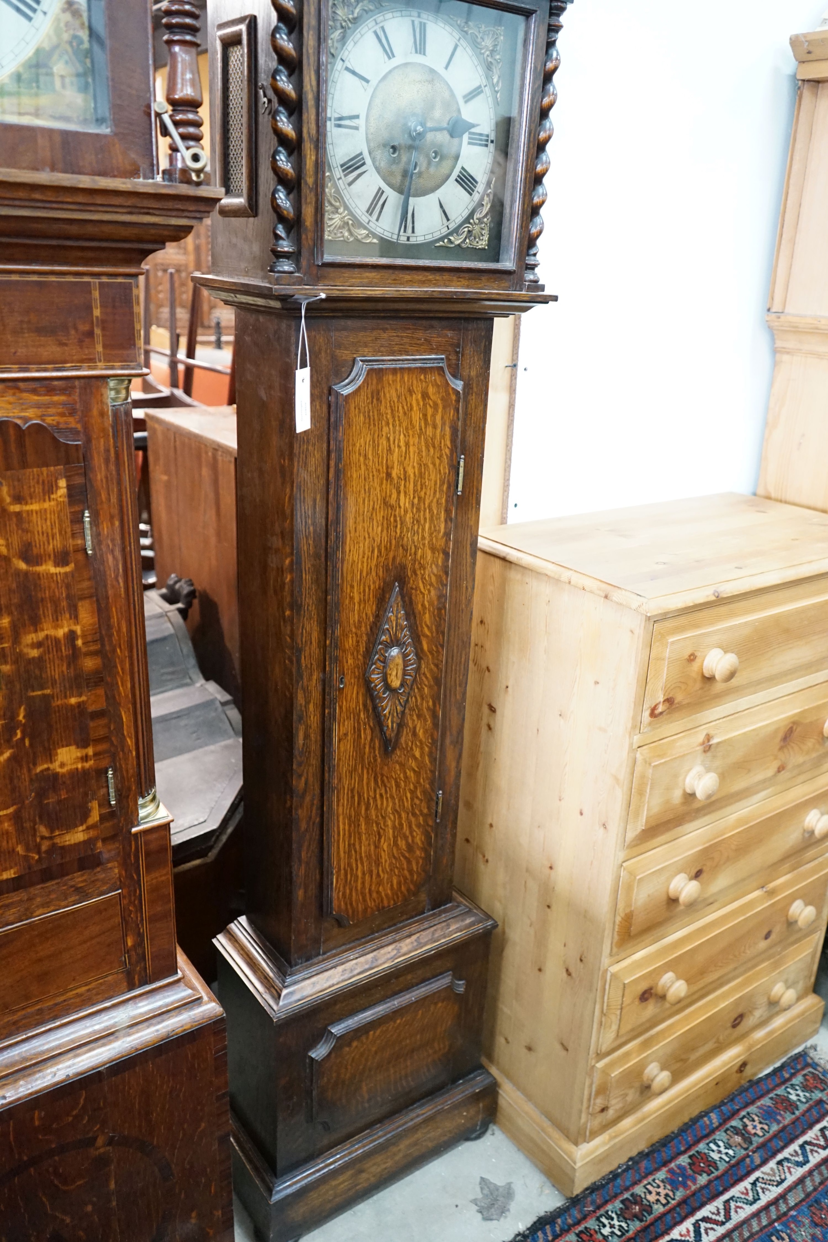 A 1920's oak 8 day longcase clock, height 187cm